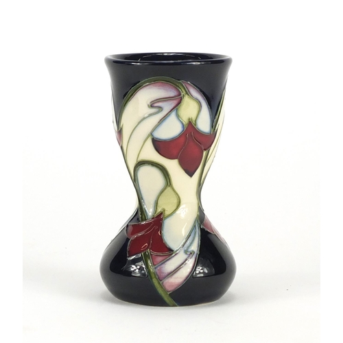 2184 - Moorcroft pottery vase with box, hand painted with stylised flowers, dated 2006, 11cm high