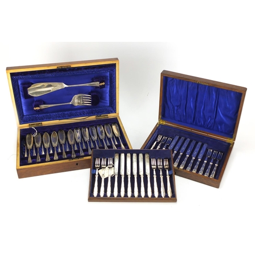 2143 - Two twelve place canteens of silver plated cutlery including a fish service with servers, the larges... 
