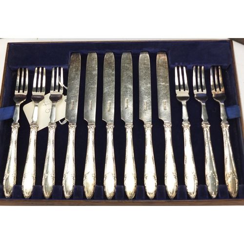 2143 - Two twelve place canteens of silver plated cutlery including a fish service with servers, the larges... 
