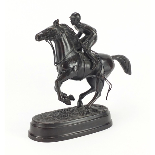 2169 - Patinated bronze model of a jockey on horseback, 30cm high