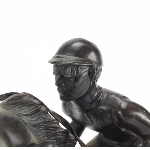 2169 - Patinated bronze model of a jockey on horseback, 30cm high