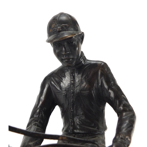 2170 - Patinated bronze model of a jockey on horseback, 31cm high