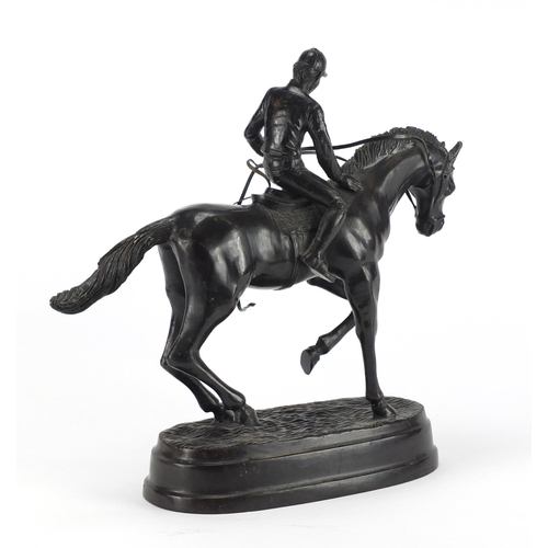 2170 - Patinated bronze model of a jockey on horseback, 31cm high