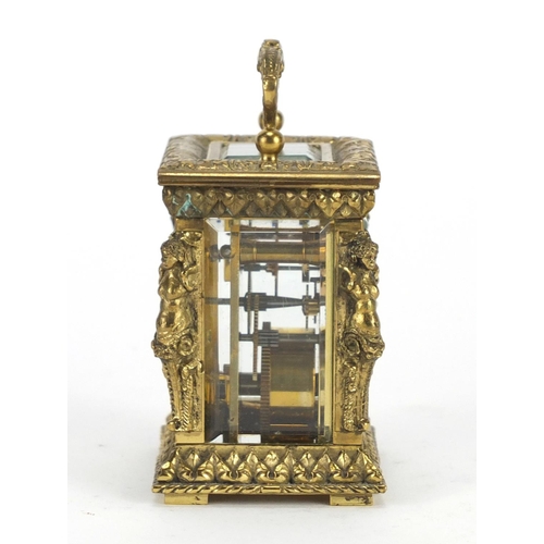 2190 - Miniature brass cased carriage clock by Charles Frodsham, with nude female supports, the enamelled d... 