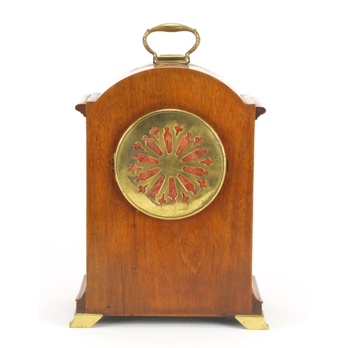 2228 - Walnut cased bracket clock striking on a gong on brass feet, with French movement, the enamelled dia... 