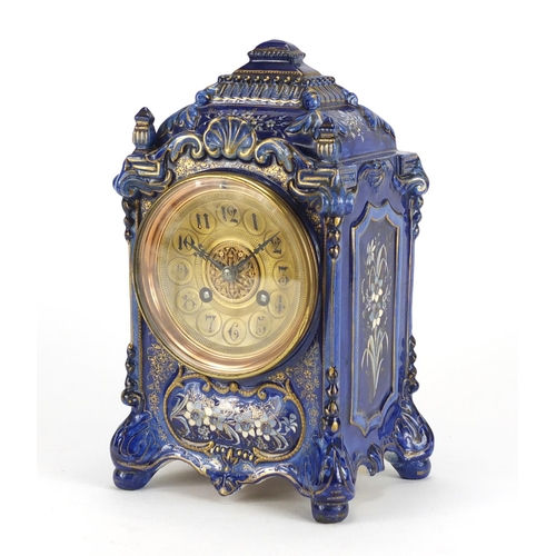 2339 - French pottery mantel clock striking on a gong gilded with flowers, the ornate brass dial with Arabi... 
