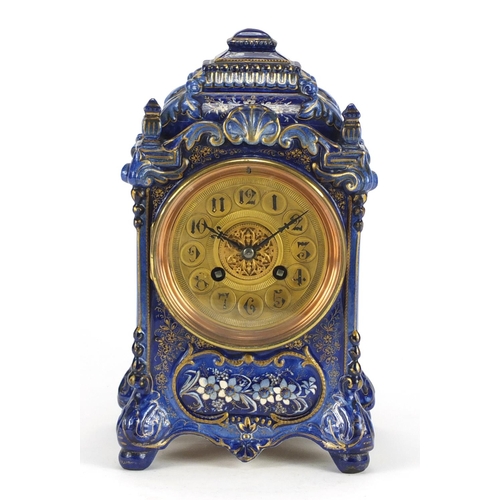 2339 - French pottery mantel clock striking on a gong gilded with flowers, the ornate brass dial with Arabi... 