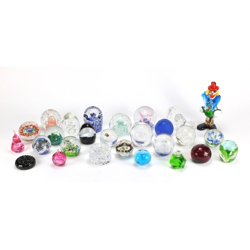 2431 - Colourful glass paperweights and a Murano glass clown including Caithness, Royal Doulton and Val Sai... 