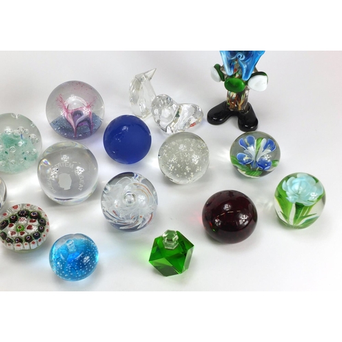 2431 - Colourful glass paperweights and a Murano glass clown including Caithness, Royal Doulton and Val Sai... 