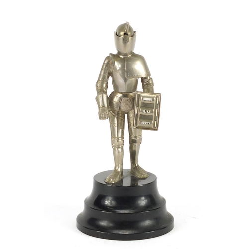 2423 - Suit of armour table lighter with perpetual calendar, 21cm high