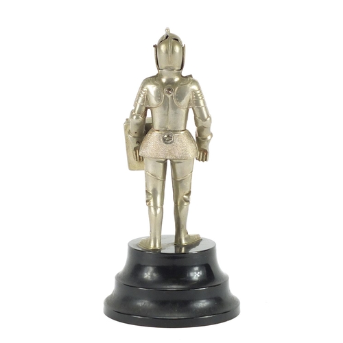 2423 - Suit of armour table lighter with perpetual calendar, 21cm high