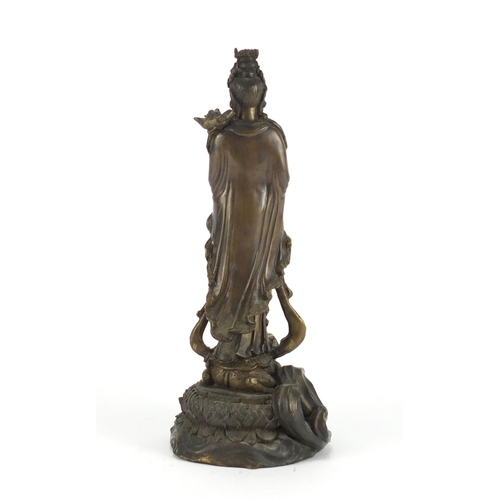 2231 - Chinese bronze figure of Guanyin standing on a toad and lotus leaf, 33cm high