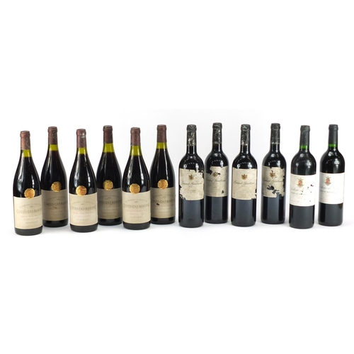 2450 - Twelve bottles of red wine comprising two bottles of 2000 Château De Calce Cotes Du Roseeillon, six ... 