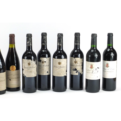 2450 - Twelve bottles of red wine comprising two bottles of 2000 Château De Calce Cotes Du Roseeillon, six ... 