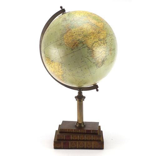 2126 - Terrestrial globe raised of a stack of faux books by Greaves & Thomas, 55cm high