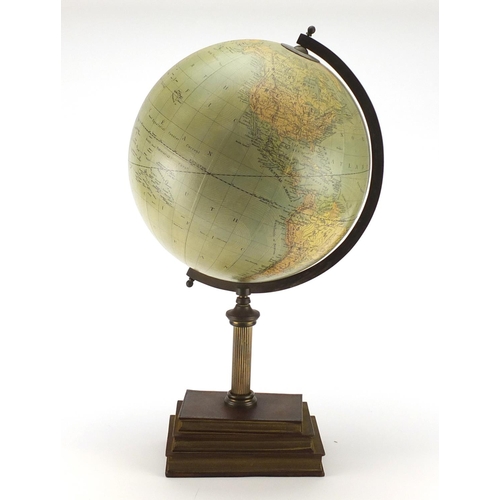 2126 - Terrestrial globe raised of a stack of faux books by Greaves & Thomas, 55cm high