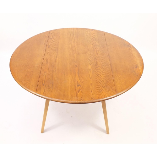 2003 - Ercol light elm drop leaf dining table and four stick back chairs, the table 71cm H x 65cm W (folded... 