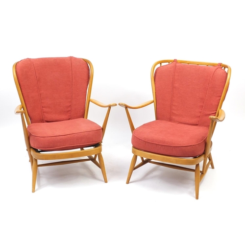 2036 - Pair of Ercol light elm easy chairs, 82cm high
