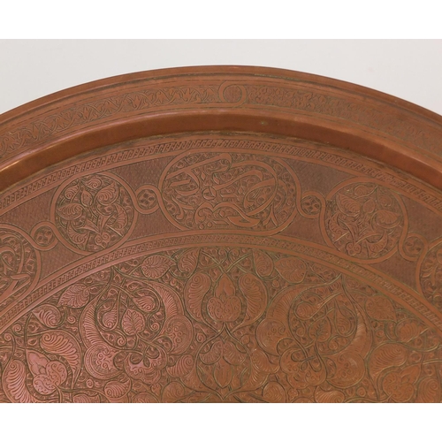 2107 - Good Islamic Cairo Ware folding tray top table, the tray finely engraved with script and foliate mot... 