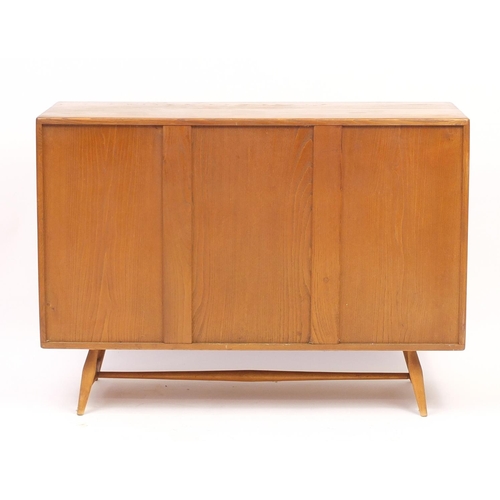 2004 - Ercol Windsor light elm sideboard fitted with three cupboard doors and a drawer, 82cm H x 115cm W x ... 