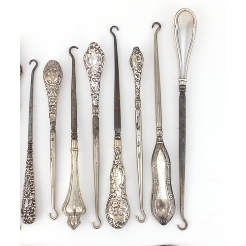 2639 - Collection of Victorian and later silver handled button hooks, some embossed with putti, various hal... 