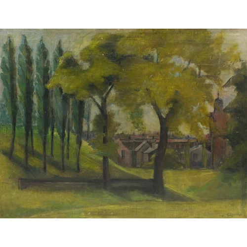 2522 - Woodland before a town, oil on canvas, bearing a signature C Ginner, framed, 66cm x 50cm