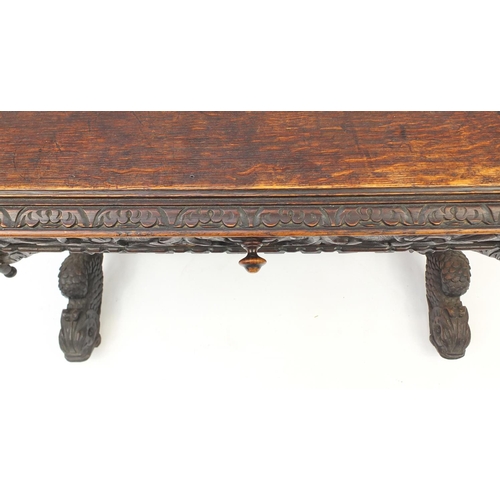 2040 - 19th century Flemish oak centre table carved with lion heads and dolphin feet, 75cm H x 100cm W x 65... 