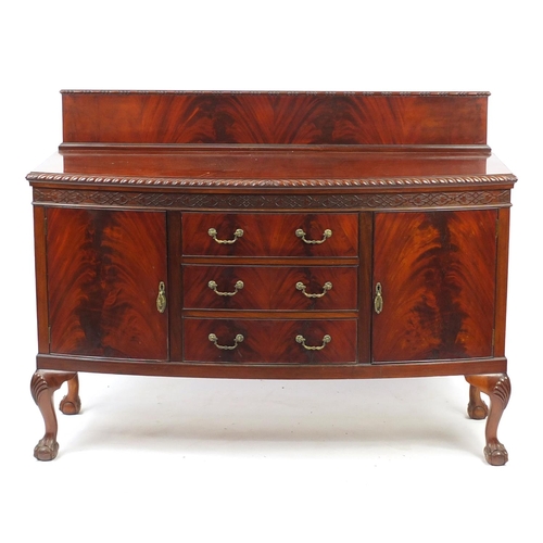 2021 - Chippendale style mahogany bow front sideboard fitted with two cupboard doors and three central draw... 