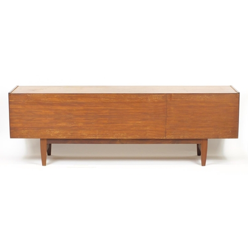 2012 - Vintage teak sideboard fitted with a fall, pair of cupboard doors and three drawers, possibly Scandi... 