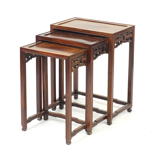 2027 - Nest of three Chinese hardwood occasional tables, the largest 65cm H x 51cm W x 32cm D