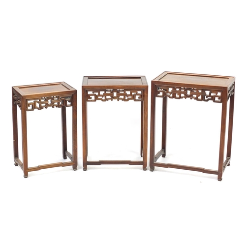 2027 - Nest of three Chinese hardwood occasional tables, the largest 65cm H x 51cm W x 32cm D