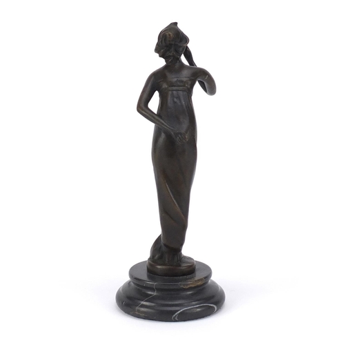 2490 - Patinated bronze study of an Art Deco female, raised on a circular marble base, 21cm high