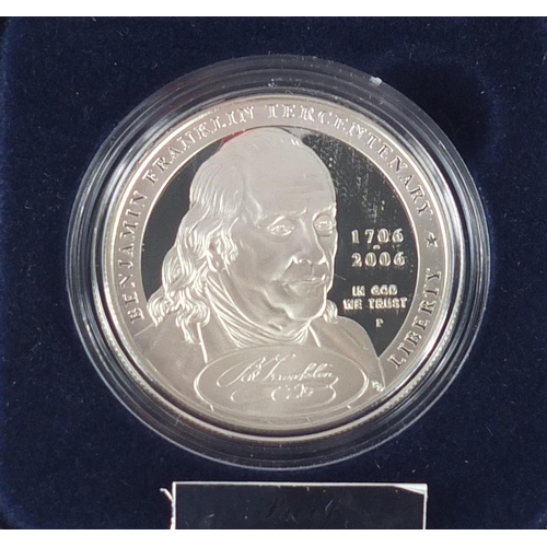 2715 - Four United States Mint silver proof dollars, with cases and boxes comprising Benjamin Franklin, US ... 