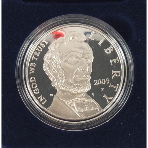 2719 - Four United States Mint silver proof dollars, with cases and boxes comprising Abraham Lincoln, 2009 ... 