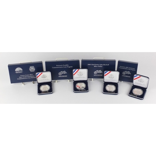 2716 - Four United States Mint silver proof dollars with cases and boxes comprising First Flight Centennial... 