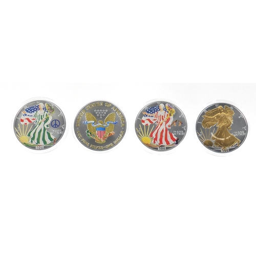 2702 - Four United States of America coloured silver dollars, with certificates comprising dates 2001, 2003... 