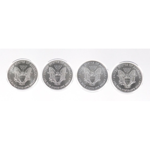 2705 - Four United States of America silver eagle dollars with certificates comprising dates 2001, 2002, 20... 