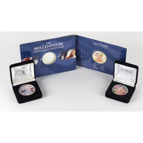 2721 - Three United States coloured silver dollars, two with cases comprising dates 2000, 2003 and 2005