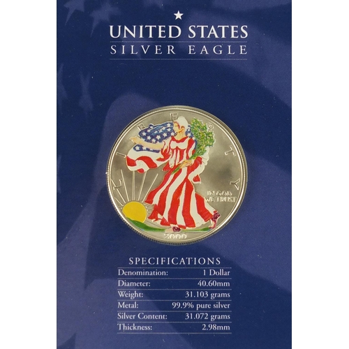 2721 - Three United States coloured silver dollars, two with cases comprising dates 2000, 2003 and 2005