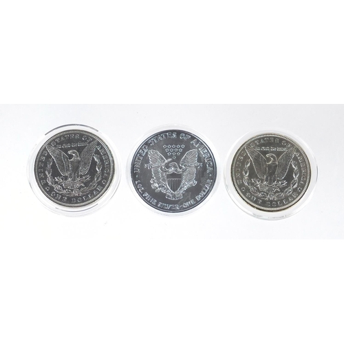 2706 - Three United States of America silver dollars, two with certificates comprising two Morgan dollars d... 