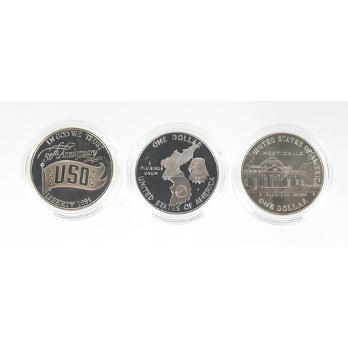2707 - Five United States of America silver dollars  with certificates including Korean War, World War II a... 