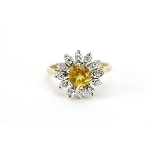 2825 - 9ct gold citrine and clear stone flower head ring, size M, 3.9g
