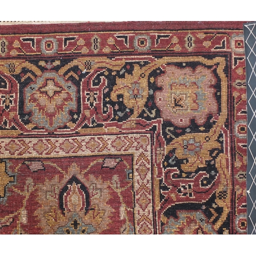 2047 - Rectangular Indian rug having an all over floral design onto a red ground, 223cm x 155cm