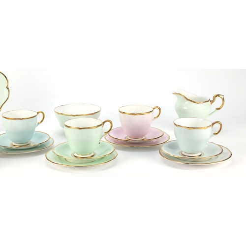 2367 - Paragon Harlequin six place tea service with milk jug and sugar bowl, the largest 25cm in length