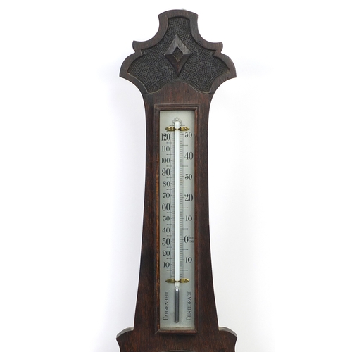 2111 - Carved oak aneroid barometer, 74cm long