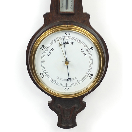 2111 - Carved oak aneroid barometer, 74cm long