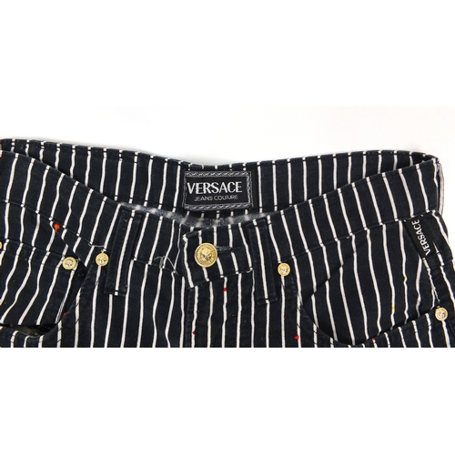 2616 - Pair of vintage Versace graffiti trousers, size 31 45
