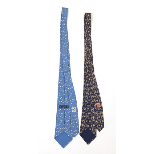 2620 - Two Hermes silk ties, one with box, decorated with monkey's and elephants, each 140cm in length