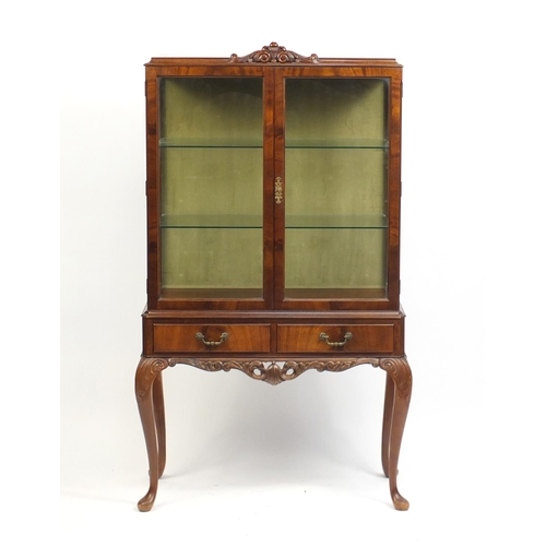 3 - Mahogany display cabinet with a pair of glazed doors enclosing two shelves above two frieze drawers,... 