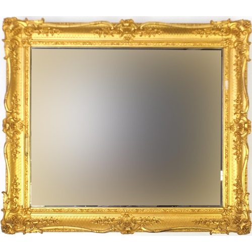 32 - Rectangular ornate gilt framed wall hanging mirror, 68cm x 58cm